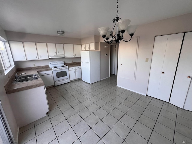 2801 S 1st Ave, Yuma, AZ 85364 - kitchen featuring white appliances, under cabinet range hood, a sink, and white cabinetry