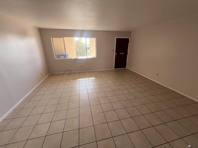 2801 S 1st Ave, Yuma, AZ 85364 - unfurnished room featuring light tile patterned flooring and baseboards