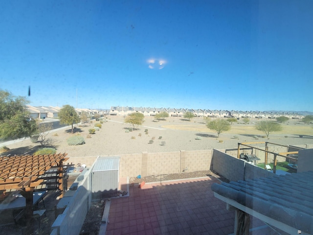 view of patio / terrace with a fenced backyard and a residential view