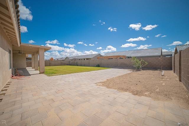 view of patio / terrace with ceiling fan and a fenced backyard