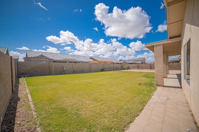 view of yard with a fenced backyard and a patio area