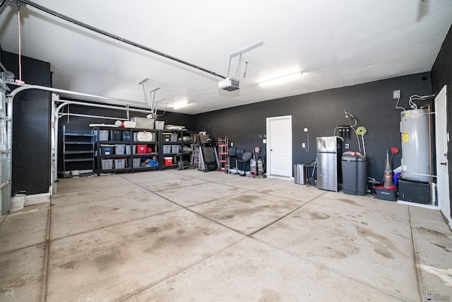 garage with a garage door opener and electric water heater