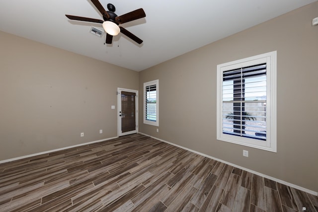 12839 S Drucilla Ln, Yuma, AZ 85367 - unfurnished room with wood finished floors, a ceiling fan, and baseboards