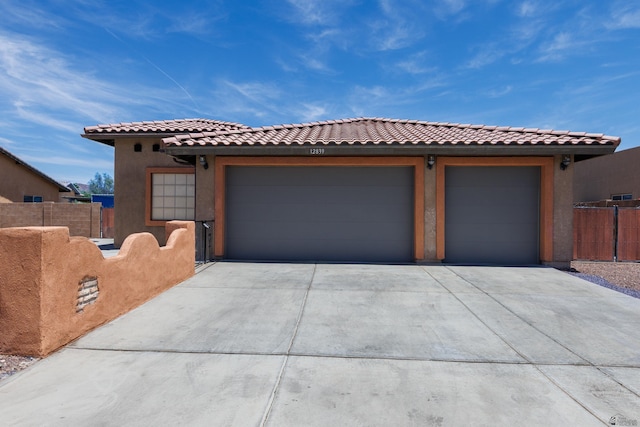 12839 S Drucilla Ln, Yuma, AZ 85367 - view of front facade featuring stucco siding, a tile roof, and driveway