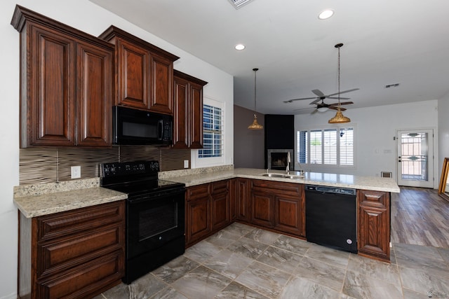 12839 S Drucilla Ln, Yuma, AZ 85367 - kitchen featuring black appliances, a ceiling fan, a peninsula, a sink, and open floor plan