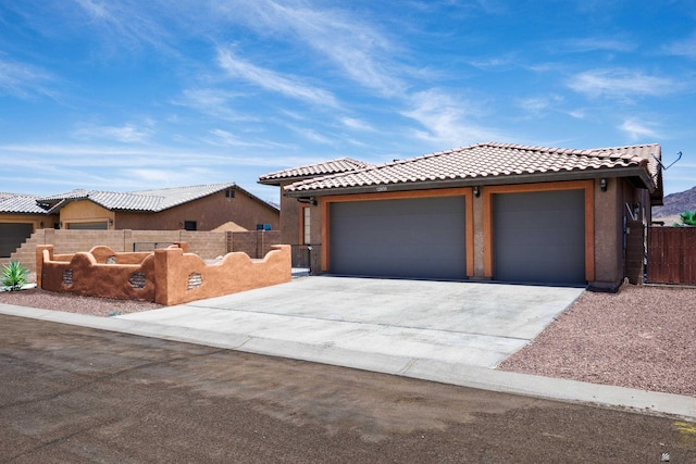 12839 S Drucilla Ln, Yuma, AZ 85367 - view of front of house featuring a tiled roof, concrete driveway, and stucco siding