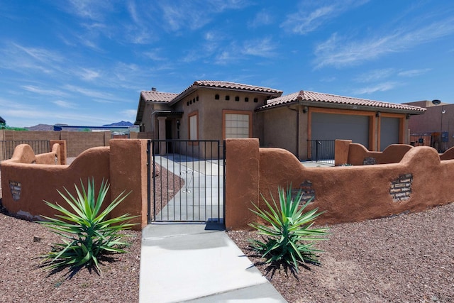 12839 S Drucilla Ln, Yuma, AZ 85367 - view of front facade featuring a gate, a fenced front yard, and a tile roof