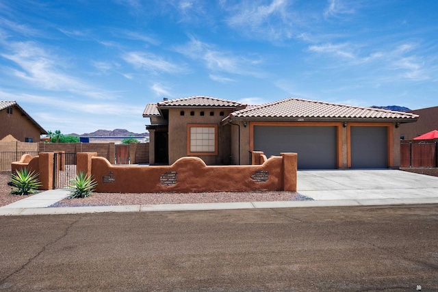 12839 S Drucilla Ln, Yuma, AZ 85367 - view of front of property featuring a fenced front yard, an attached garage, driveway, and a tiled roof