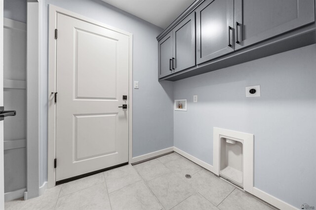 10858 E 45th Ln, Yuma, AZ 85367 - washroom with hookup for an electric dryer, washer hookup, cabinet space, baseboards, and light tile patterned flooring