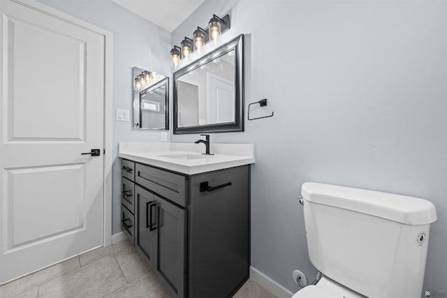 10858 E 45th Ln, Yuma, AZ 85367 - bathroom with toilet, vanity, baseboards, and tile patterned floors