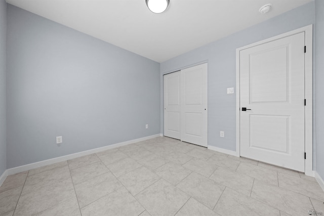 10858 E 45th Ln, Yuma, AZ 85367 - unfurnished bedroom featuring baseboards and a closet