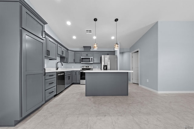 10858 E 45th Ln, Yuma, AZ 85367 - kitchen with stainless steel appliances, light countertops, a center island, hanging light fixtures, and recessed lighting