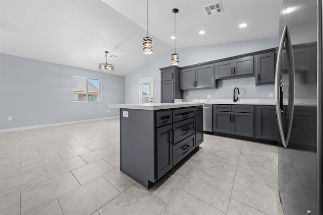 10858 E 45th Ln, Yuma, AZ 85367 - kitchen featuring freestanding refrigerator, lofted ceiling, light countertops, a kitchen island, and light tile patterned flooring