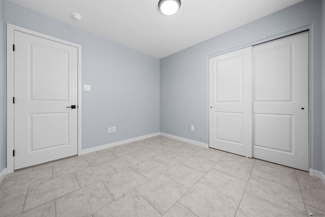 10858 E 45th Ln, Yuma, AZ 85367 - unfurnished bedroom with baseboards and a closet
