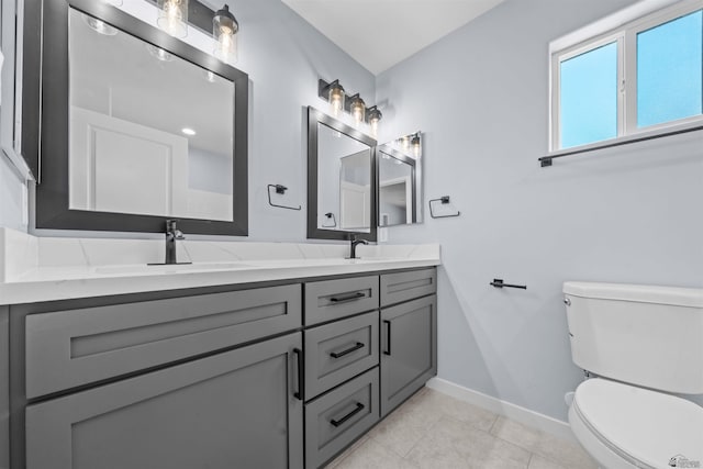 10858 E 45th Ln, Yuma, AZ 85367 - bathroom featuring double vanity, baseboards, toilet, and tile patterned flooring
