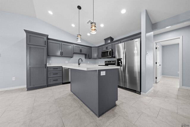 10858 E 45th Ln, Yuma, AZ 85367 - kitchen featuring stainless steel appliances, light countertops, lofted ceiling, a kitchen island, and hanging light fixtures