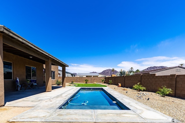 14817 E 47th Dr, Yuma, AZ 85367 - view of swimming pool with a fenced backyard, a patio area, and a mountain view