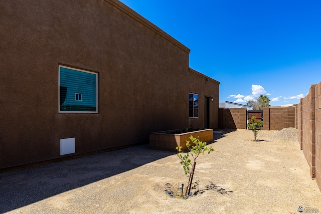 14817 E 47th Dr, Yuma, AZ 85367 - view of property exterior with a fenced backyard and stucco siding