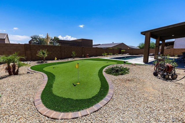 14817 E 47th Dr, Yuma, AZ 85367 - fenced backyard with a putting area and a patio area