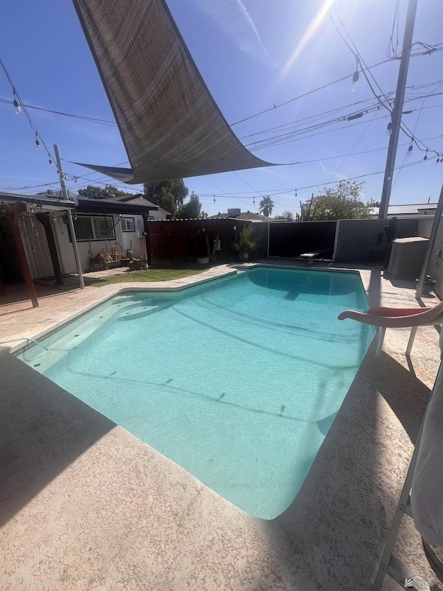 1911 S 11th Ave, Yuma, AZ 85364 - view of pool with a water slide, a diving board, and a patio
