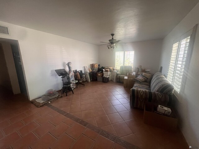 1911 S 11th Ave, Yuma, AZ 85364 - living room with ceiling fan and dark tile patterned flooring