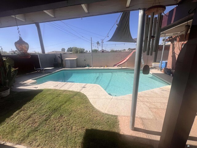 1911 S 11th Ave, Yuma, AZ 85364 - view of pool featuring a water slide and a fenced backyard