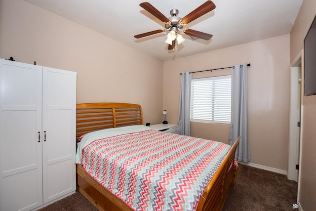 12127 E 35th St, Yuma, AZ 85367 - bedroom with baseboards, a ceiling fan, and dark carpet