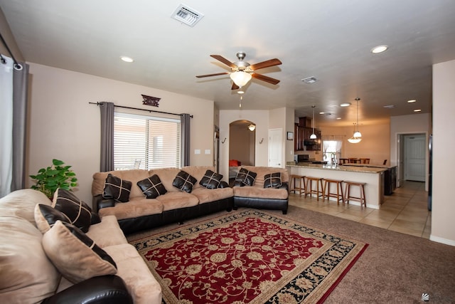 12127 E 35th St, Yuma, AZ 85367 - living room featuring visible vents, light tile patterned flooring, ceiling fan, recessed lighting, and arched walkways