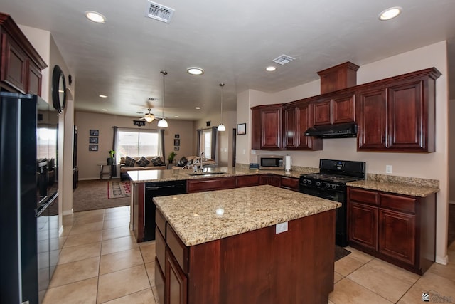 12127 E 35th St, Yuma, AZ 85367 - kitchen with a sink, a peninsula, under cabinet range hood, visible vents, and black appliances
