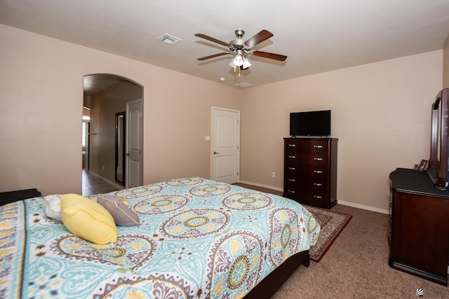 12127 E 35th St, Yuma, AZ 85367 - bedroom with a ceiling fan, visible vents, arched walkways, baseboards, and carpet