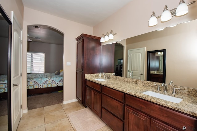12127 E 35th St, Yuma, AZ 85367 - ensuite bathroom featuring double vanity, tile patterned flooring, a sink, and ensuite bathroom