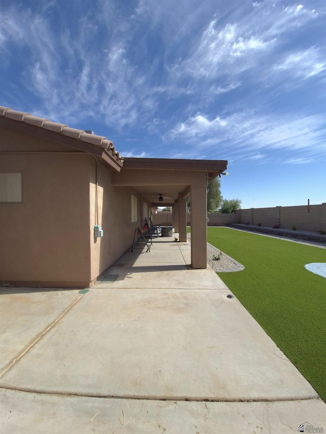 10178 S Cony Ave, Yuma, AZ 85367 - view of side of property with stucco siding and a patio area