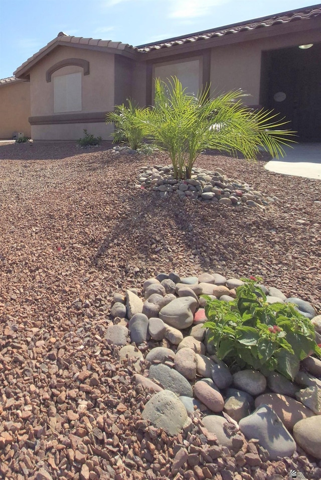 10178 S Cony Ave, Yuma, AZ 85367 - view of side of home with a tile roof and stucco siding