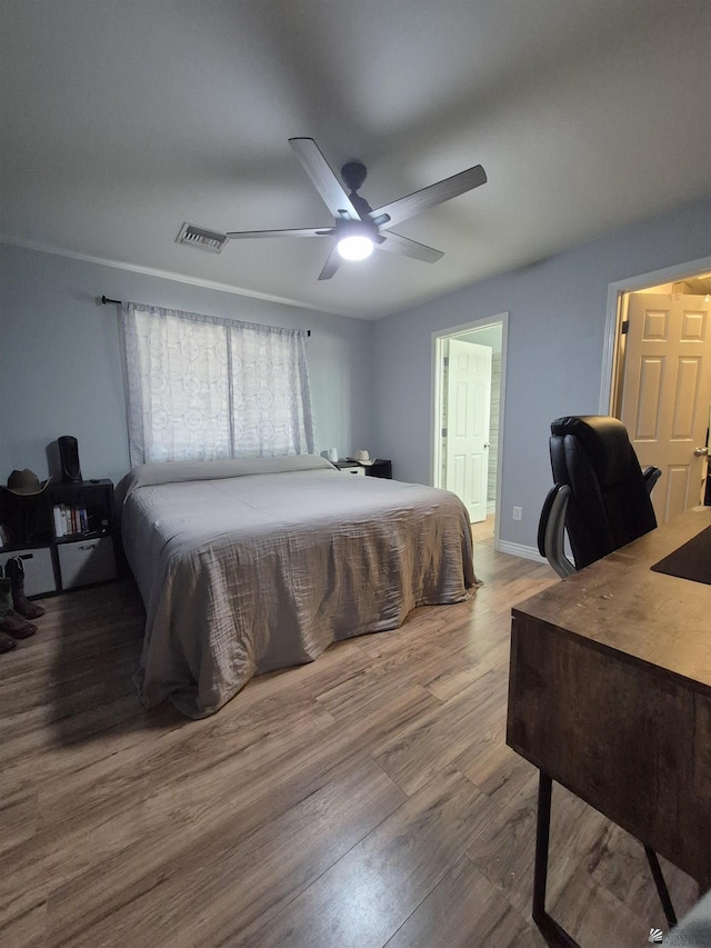 10178 S Cony Ave, Yuma, AZ 85367 - bedroom with wood finished floors, a desk, ceiling fan, and baseboards