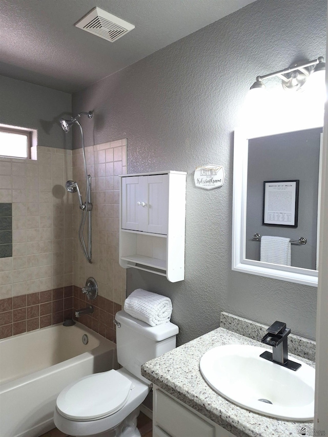 10178 S Cony Ave, Yuma, AZ 85367 - full bathroom featuring a textured wall, bathtub / shower combination, vanity, and toilet