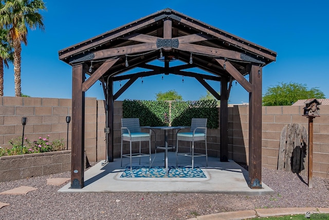 view of patio / terrace featuring a gazebo and a fenced backyard