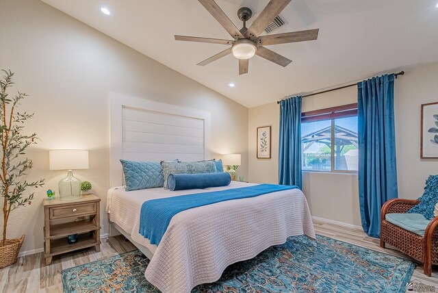 bedroom featuring baseboards, recessed lighting, light wood-style flooring, and lofted ceiling