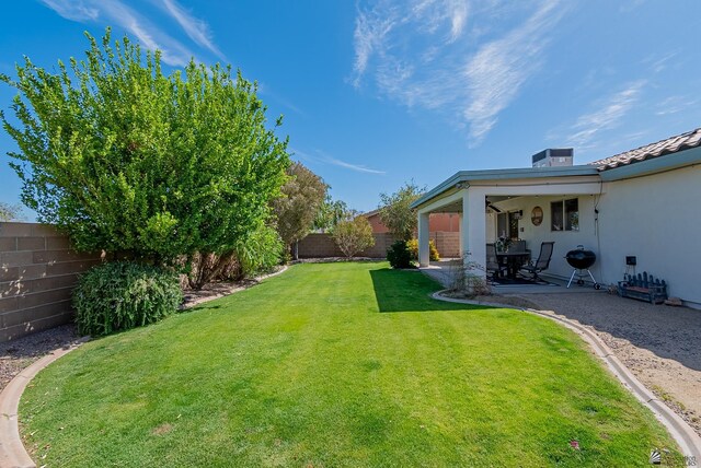 view of yard with a fenced backyard and a patio area
