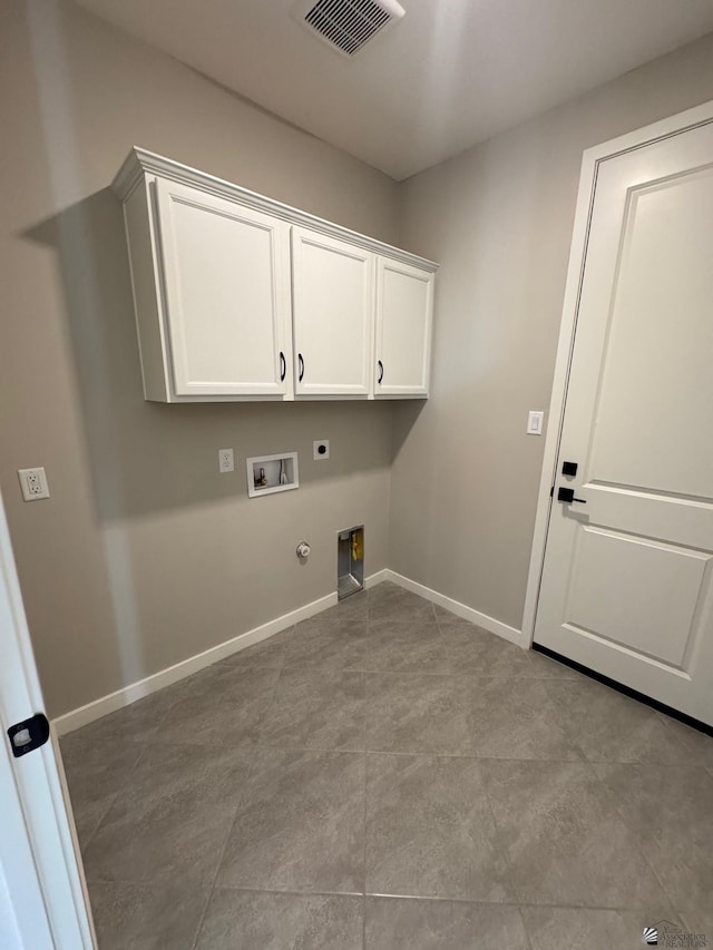 washroom with cabinet space, washer hookup, gas dryer hookup, hookup for an electric dryer, and visible vents