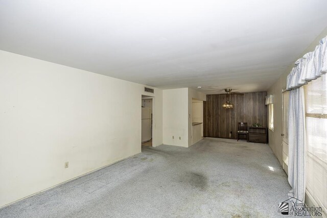 232 E 25th Pl, Yuma, AZ 85364 - unfurnished living room featuring light colored carpet and visible vents