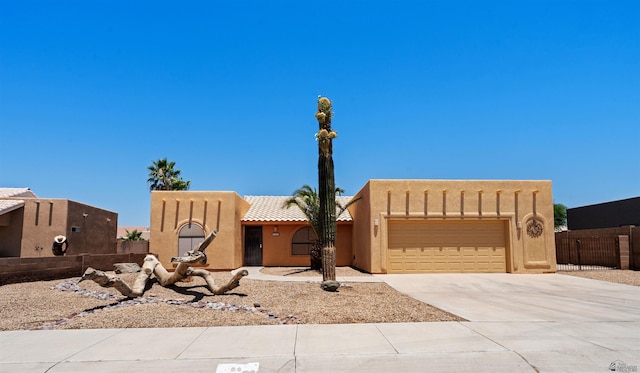 11212 E 37th Ln, Yuma, AZ 85367 - adobe home with an attached garage, driveway, stucco siding, and a tile roof
