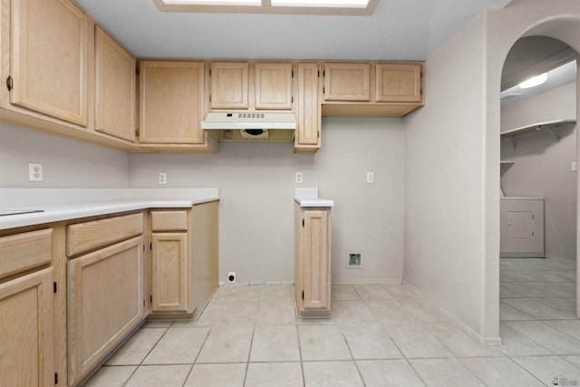 11212 E 37th Ln, Yuma, AZ 85367 - kitchen featuring washer / dryer, under cabinet range hood, light brown cabinetry, and light tile patterned floors