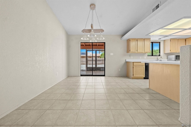 11212 E 37th Ln, Yuma, AZ 85367 - kitchen featuring light brown cabinetry, light countertops, a sink, a textured wall, and dishwasher