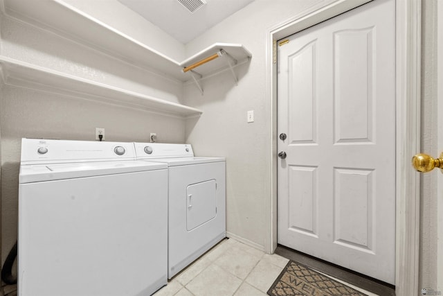 11212 E 37th Ln, Yuma, AZ 85367 - washroom featuring separate washer and dryer, light tile patterned flooring, and baseboards