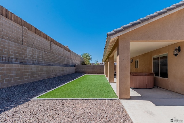 10237 S Monsoon Ave, Yuma, AZ 85365 - fenced backyard with a hot tub and a patio