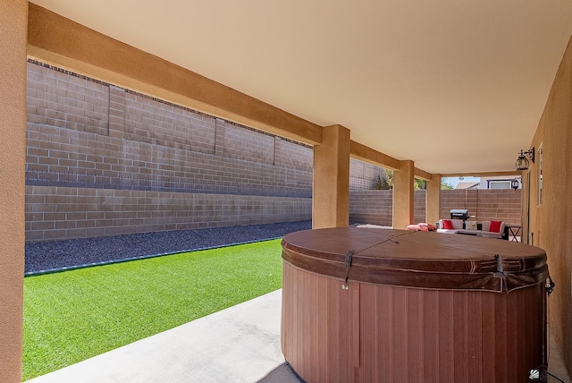 10237 S Monsoon Ave, Yuma, AZ 85365 - fenced backyard featuring a hot tub and a patio area
