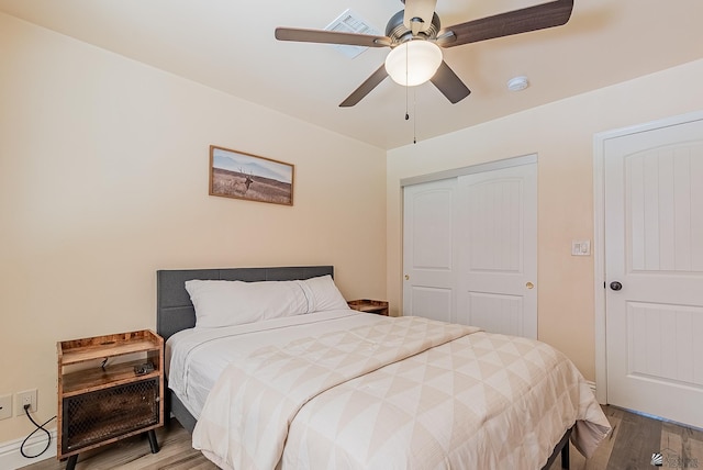 10237 S Monsoon Ave, Yuma, AZ 85365 - bedroom with wood finished floors, a closet, and a ceiling fan