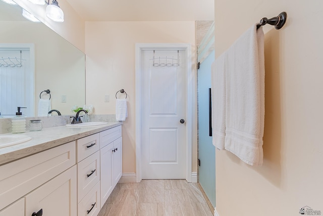 10237 S Monsoon Ave, Yuma, AZ 85365 - bathroom featuring double vanity and baseboards