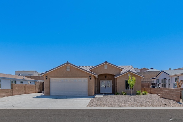 10237 S Monsoon Ave, Yuma, AZ 85365 - ranch-style home with stucco siding, an attached garage, driveway, and a tile roof