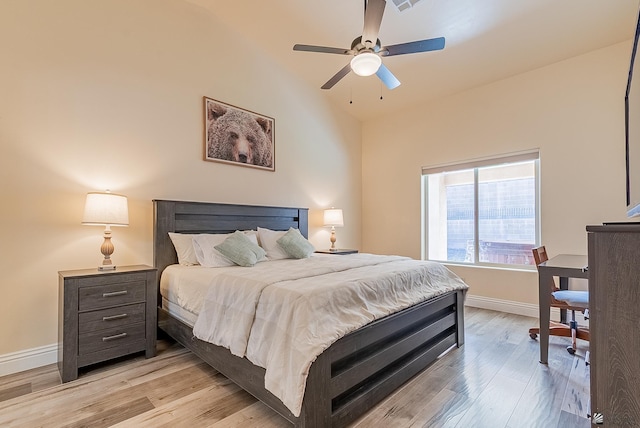 10237 S Monsoon Ave, Yuma, AZ 85365 - bedroom featuring light wood-type flooring, vaulted ceiling, and a ceiling fan